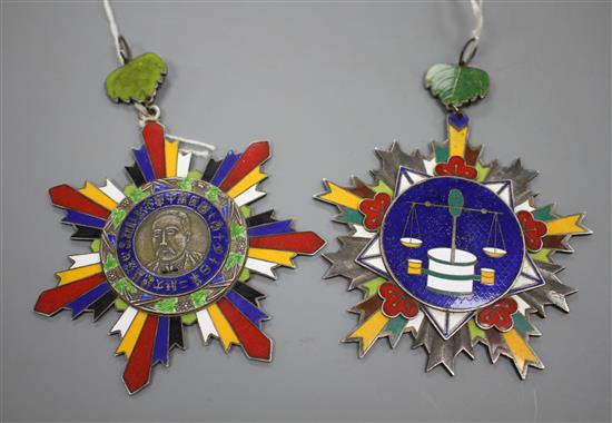Two Chinese enamelled white metal war lord medals, largest 12cm